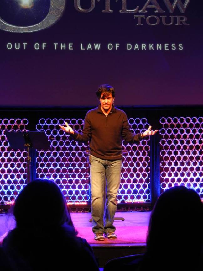 Ted Dekker speaks during his Outlaw Tour at the Miracle Theatre which is now National Community Church